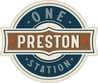 a logo for one station with a blue and white circle