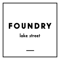a green background with the words foundry lake street in black
