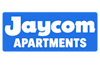 A blue sign with the text "Jaycom Apartments" on it.