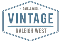 A logo for Dwell Well Vintage Raleigh West.