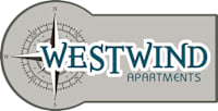 A logo for Westwind Apartments featuring a compass.