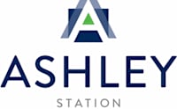 A logo with the text "ASHLEY STATION" in front of it.
