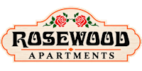 A sign that says Rosewood Apartments with two roses on it.