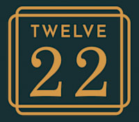 A graphic with the number 12 and the word "TWELVE" in a golden frame.