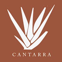 Property entrance sign with logo at Cantarra Apartments, Manor, TX