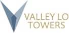 A logo with a blue triangle and the words "Valley Towers" in gold.
