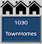A blue sign with the number 1030 and the words TownHomes on it.