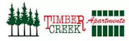 Timber Creek Apartments logo with a tree and a building.