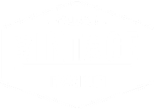 A green and white logo for Dwell Well Vintage Franklin.