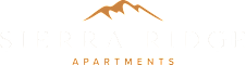 a logo for spear ridge apartments with a mountain on it