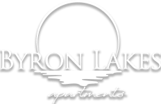 Property logo with moon and water reflection at Byron Lakes Apartments, Byron Center, 49315