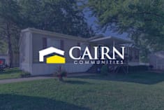 Floor Plan  A house with the logo of Cairn Communities in front of it.