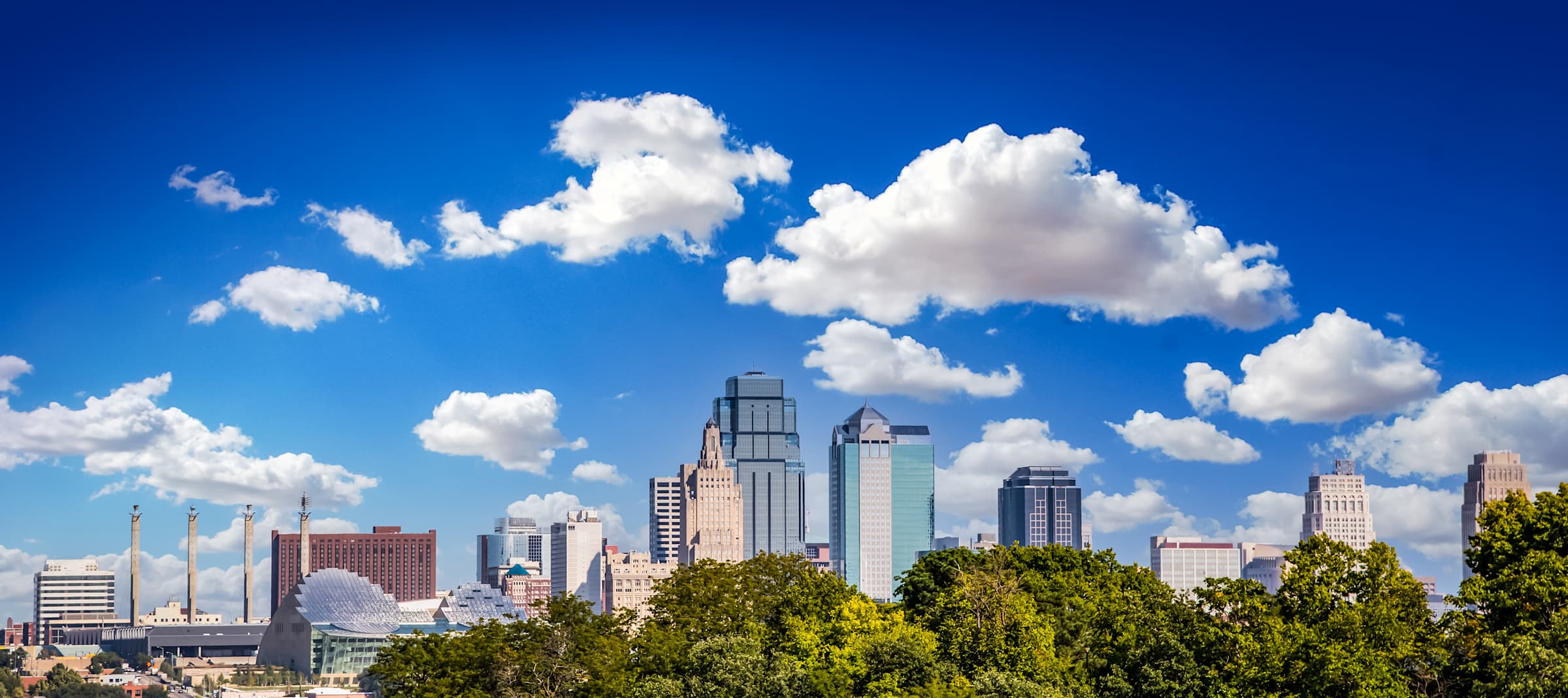 Downtown Kansas City skyline under a cloudy sky, viewed from Sky on Main