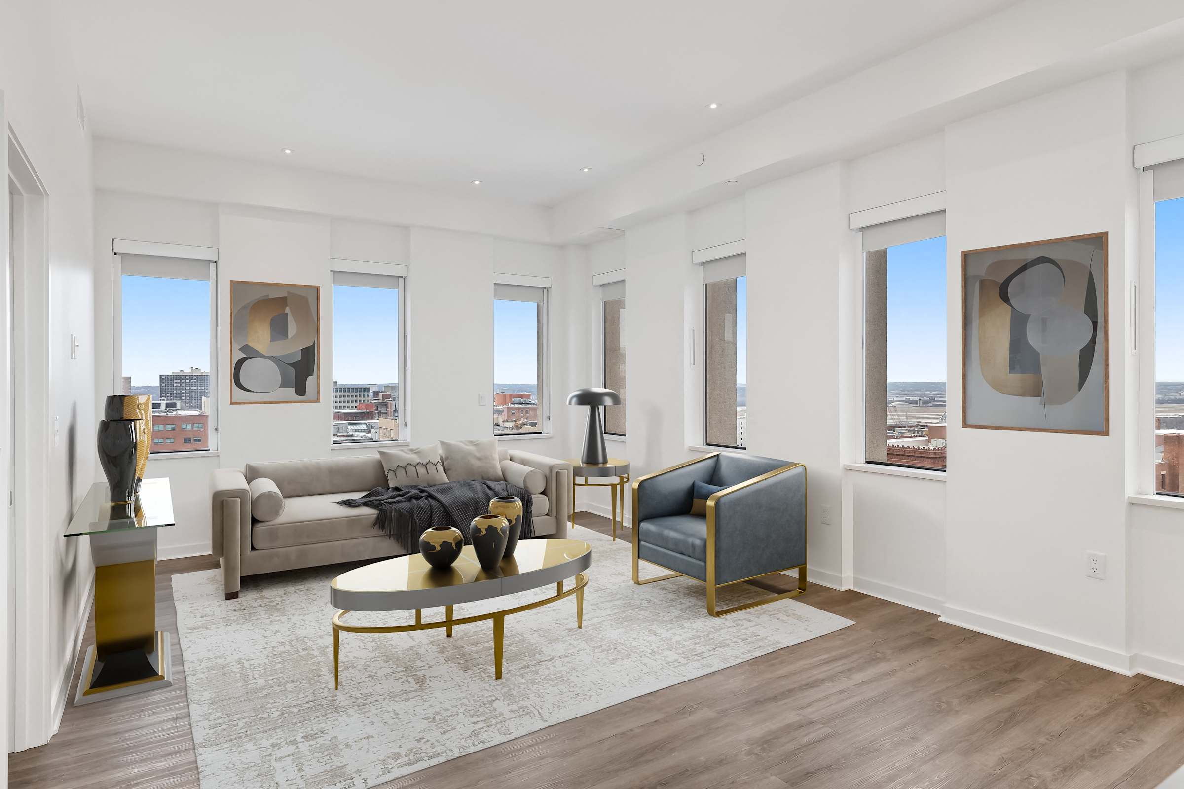 Furnished living room seating area at Sky on Main with a sofa, chairs, and a coffee table