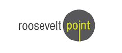 a man standing in front of a building with a sign that reads roosevelt point