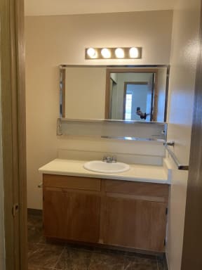 a bathroom with a sink and a mirror