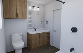 A white toilet sits next to a sink in a small bathroom.