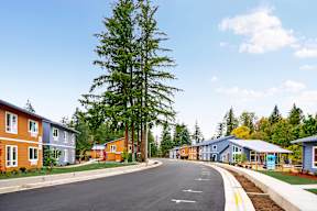 a row of houses on the side of a road