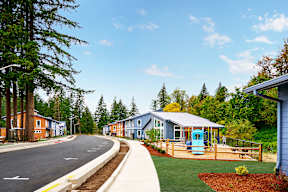 a row of houses on the side of a road