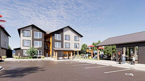 A large building with a parking lot in front of it.