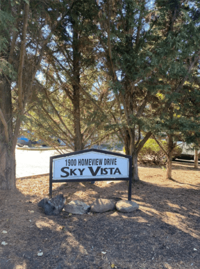 View of Sky Vista Property Sign Surrounded by Trees