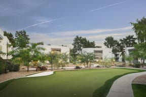 a greenhaven landscapes designed vancouver wa synthetic turf putting green with buildings in the background