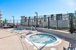 two hot tubs on expansive pool deck