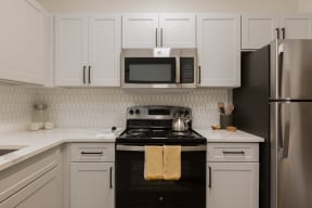 a kitchen with a stove and a microwave