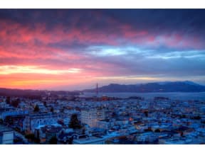 a view of the golden gate bridge in san francisco at sunset