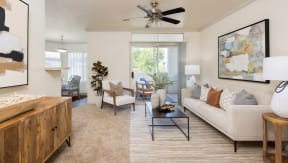 a living room with a couch chairs and a coffee table