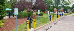 a row of electric bicycles parked in a parking lot