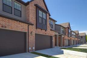 A row of houses with garages and number 818 on the front.
