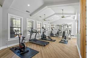 A spacious fitness center with fitness equipment at Bardin Greene new apartments in Arlington, TX.