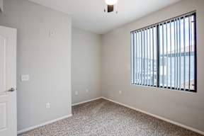 A room with a window and a door.