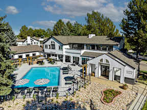A large house with a pool in the backyard.