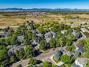 A suburban neighborhood with houses and trees.