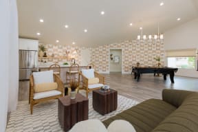 a living room with a pool table and a couch