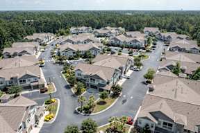 A bird's eye view of a residential neighborhood with houses and streets.