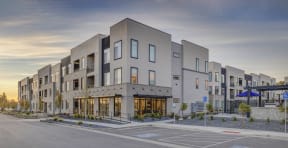 a view of a building with a street in front of it