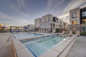 our apartments feature a swimming pool and a patio with chairs