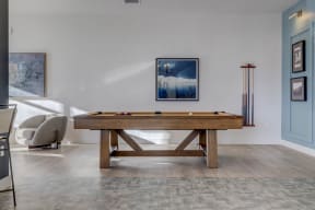 a pool table in the living room of a home