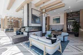 a rendering of a living room with couches and a fireplace