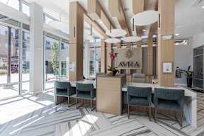 a lobby with a reception desk and chairs