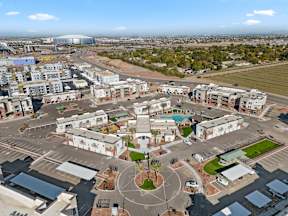 Aerial view of Cardinal 95 apartments in Glendale, AZ and city view including State Farm Stadium and Westgate District.