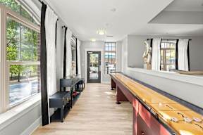 A long, narrow room with a wooden counter and benches.