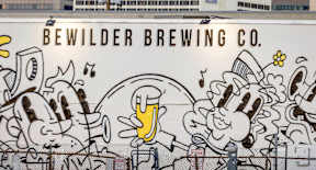 a mural on the side of a beer truck