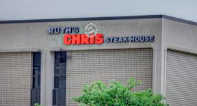 a building with a sign that reads rutschicks steak house