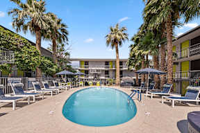 Pool with lounge chairs at Crosstown Phoenix apartments.