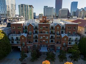 A large red brick building with a courtyard in the middle.