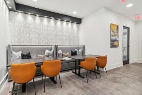 a dining room with a table and chairs